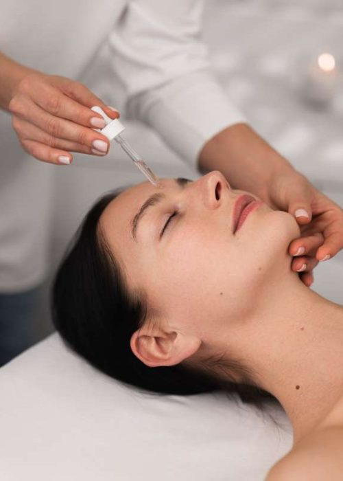 crop-cosmetician-applying-essence-on-face-of-clien-2023-11-27-05-24-35-utc (1)